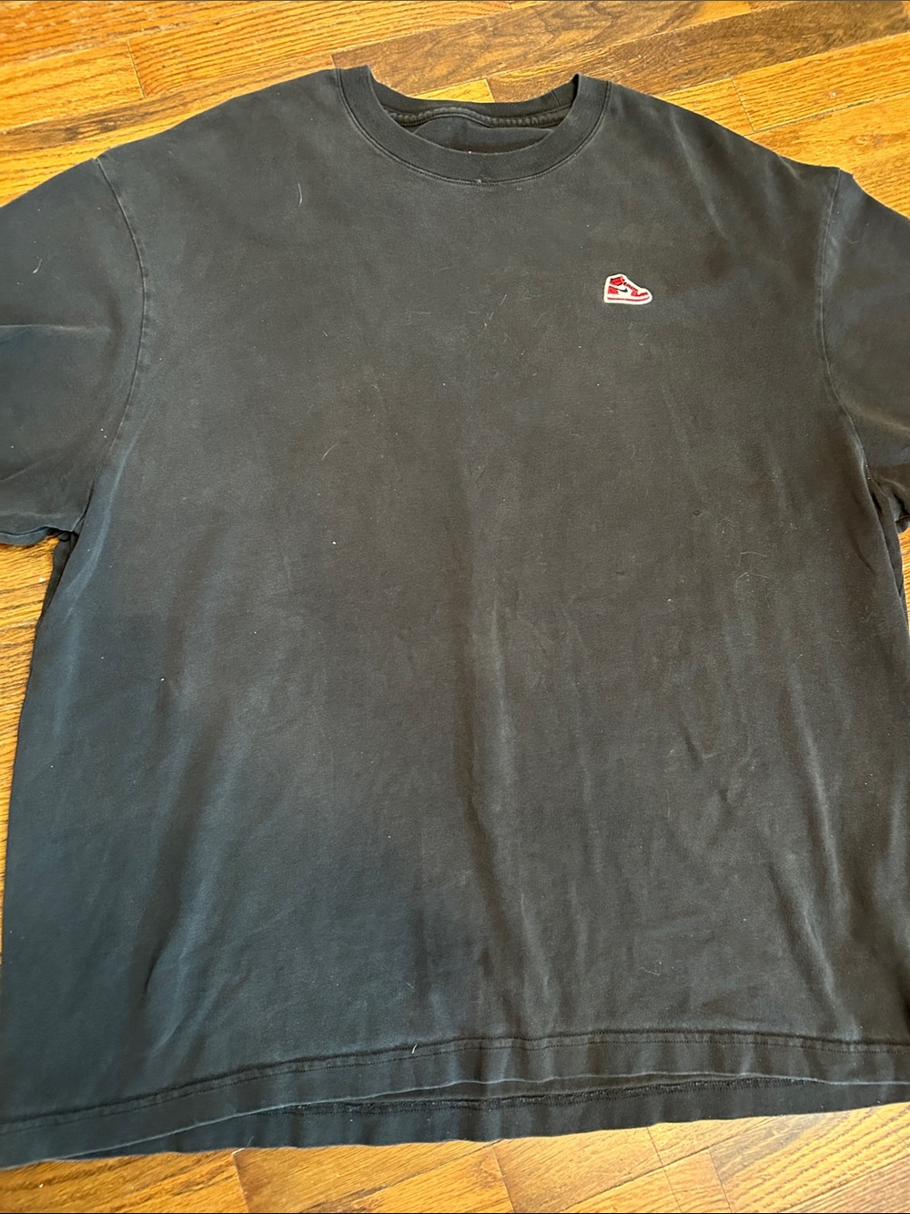 JORDAN Air Men's Black Short-Sleeve Crewneck Tee with Small Red Shoe Patch